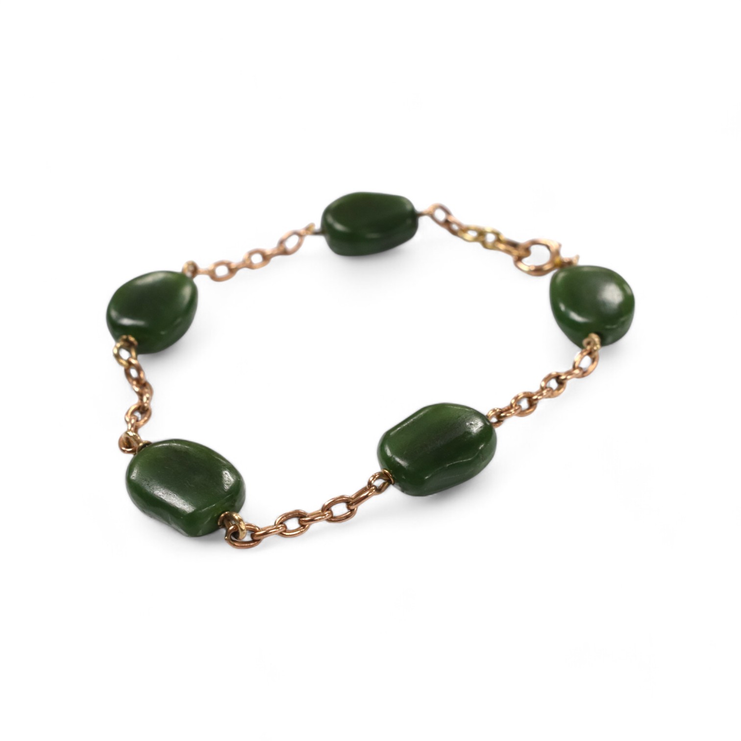 A 9ct and five stone jade bead set bracelet, 19cm, gross weight 15.2 grams. Condition - fair